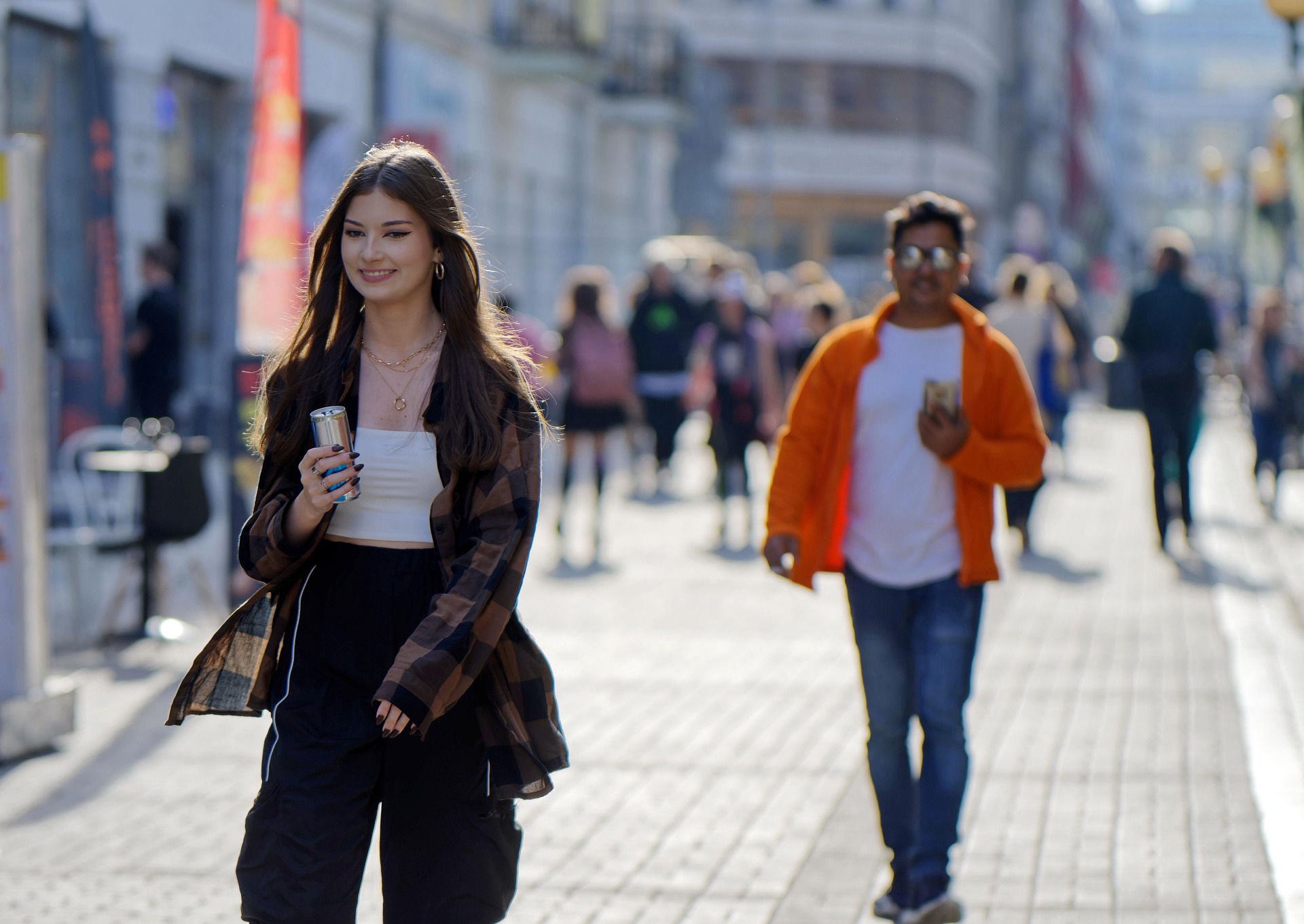 International travelers exploring a lively city street